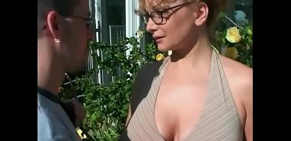  Randy lady Kandi Cox enjoys sucking and riding a cock in the garden before getting jizzed